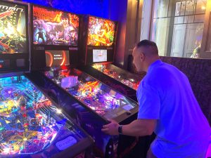 A man sharpens his skills at the pinball machine at Flipside in Loveland, Colorado A representative of Northern Colorado Community sharpens his pinball skills at the members' activity night at Flipside in Loveland, Coloraco